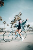 Woman rides her bike on a sunny day.