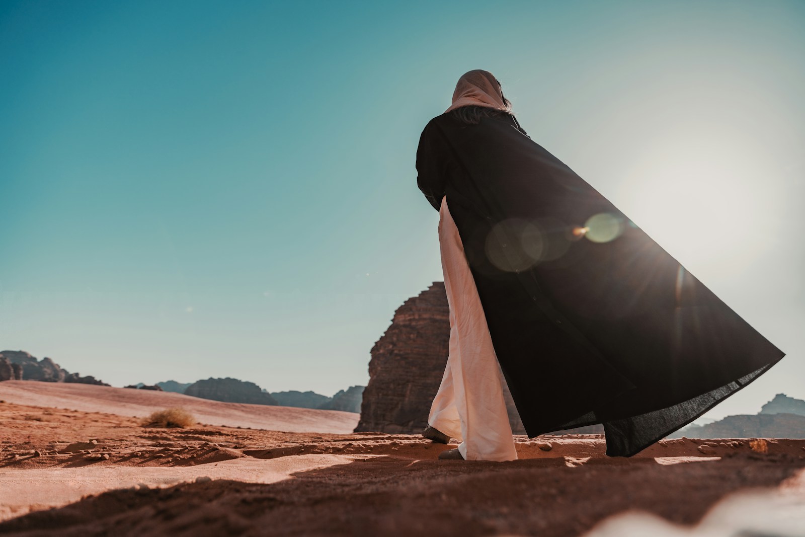 Photo by NEOM a person walking in the desert